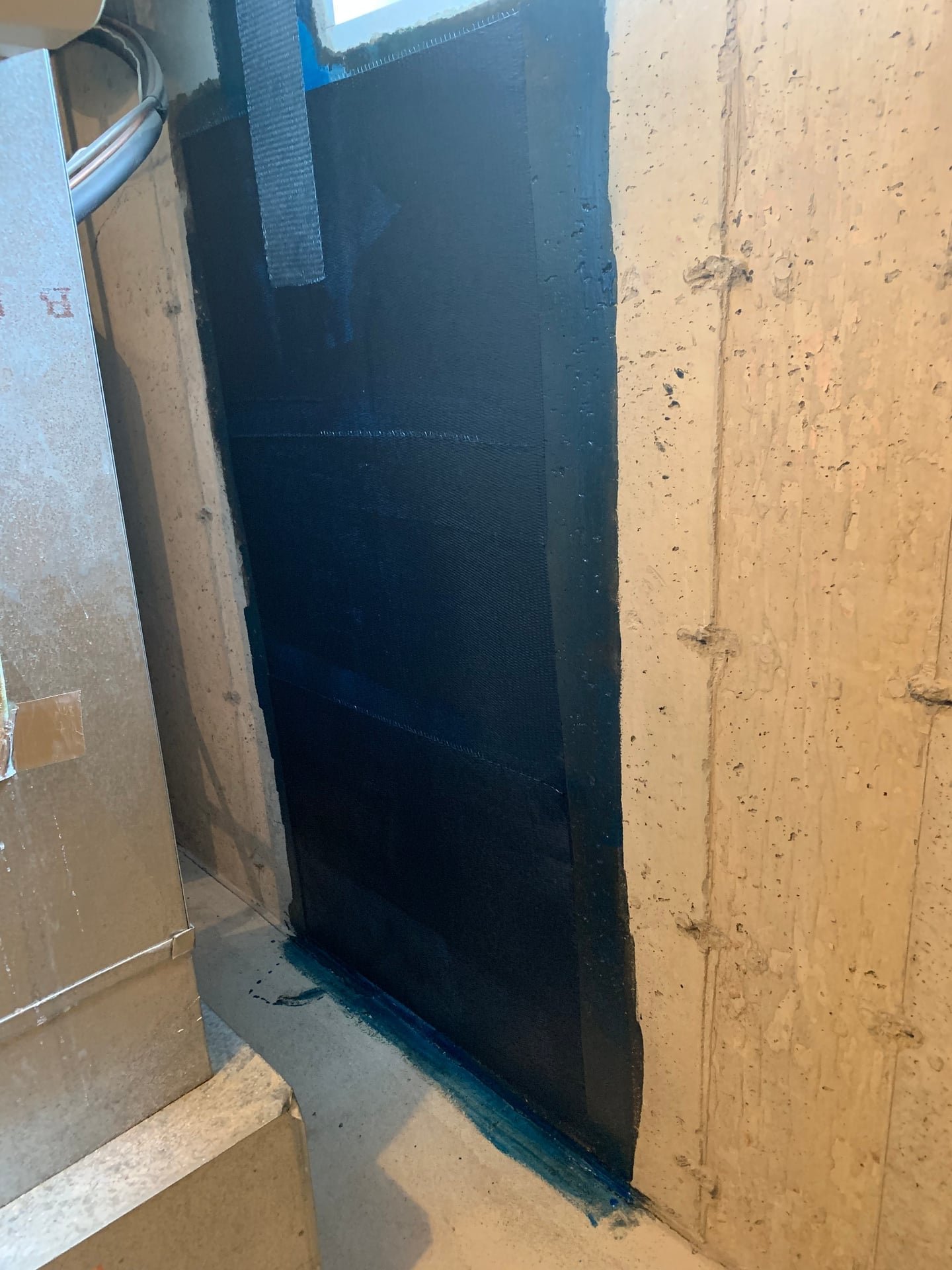 structural basement wall crack repair with epoxy injection and carbon fiber strap reinforcement in Ardsley, NY — after