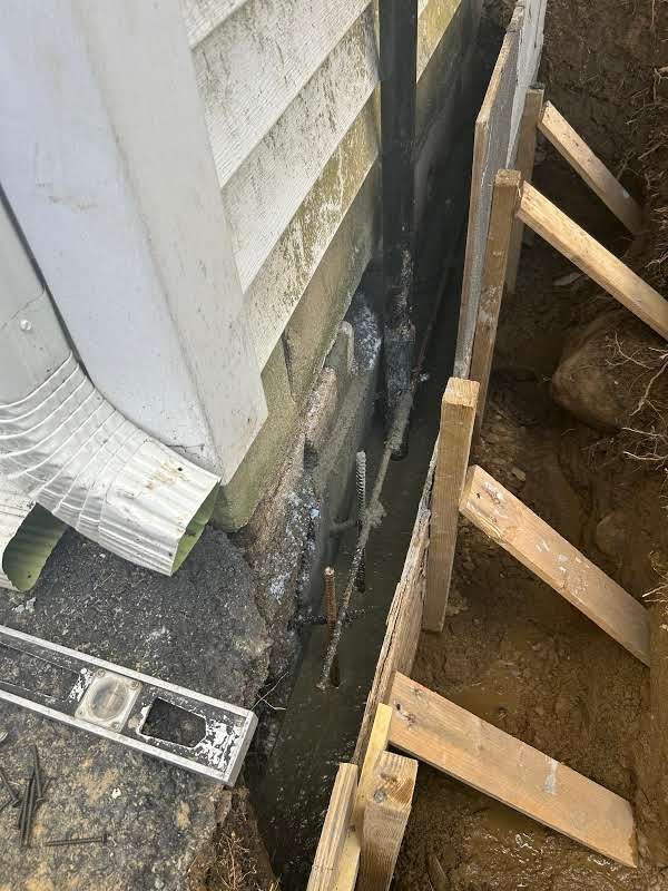 Job-site photo 1: leaking foundation crack repair with exterior excavation, masonry rebuild and waterproofing membrane in Carmel, NY