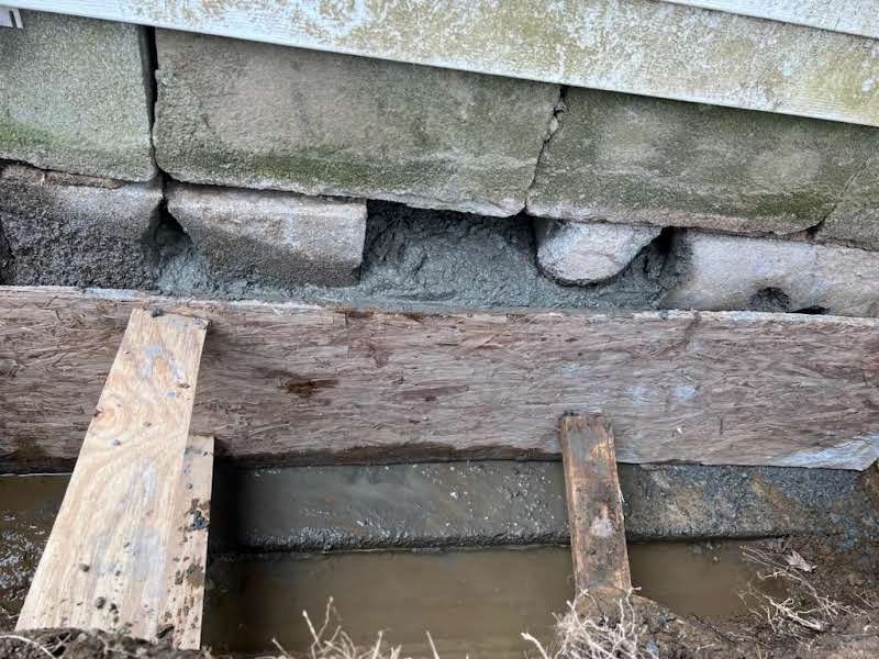 Job-site photo 2: leaking foundation crack repair with exterior excavation, masonry rebuild and waterproofing membrane in Carmel, NY