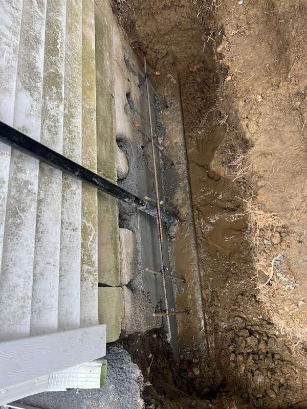 Job-site photo 3: leaking foundation crack repair with exterior excavation, masonry rebuild and waterproofing membrane in Carmel, NY
