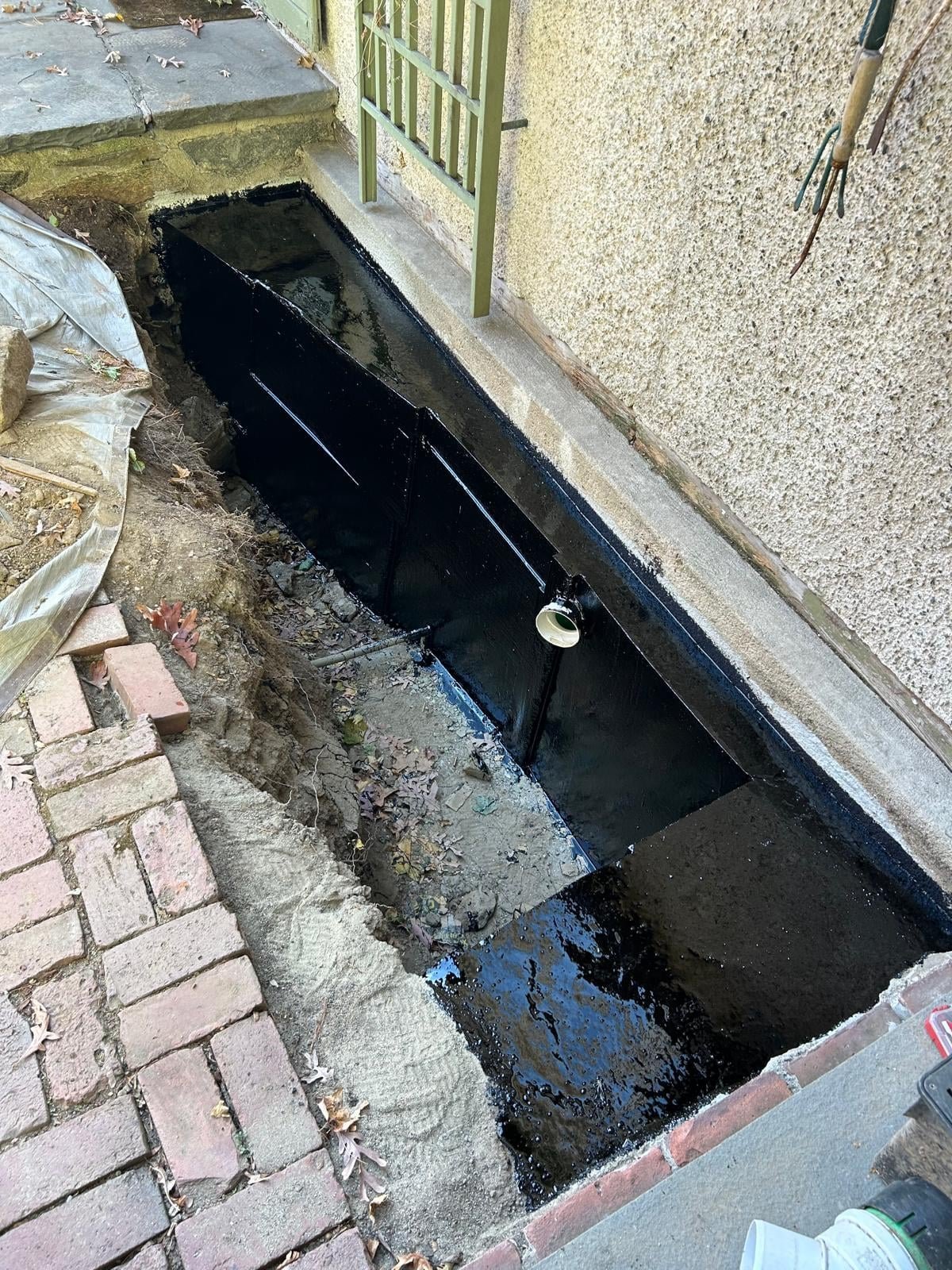 exterior excavation foundation waterproofing for a chronic basement leak in Greenwich, CT — after