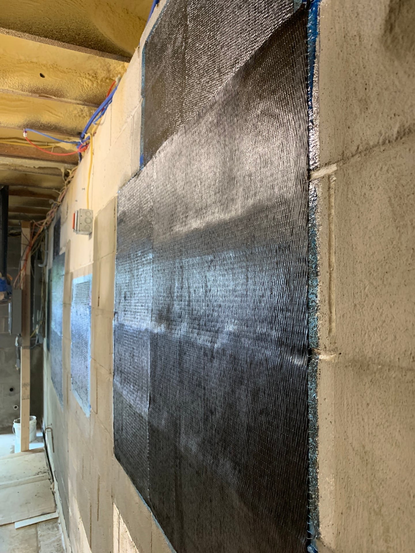 leaking basement wall crack repair with carbon fiber straps and waterproofing membrane in Mount Kisco, NY — after