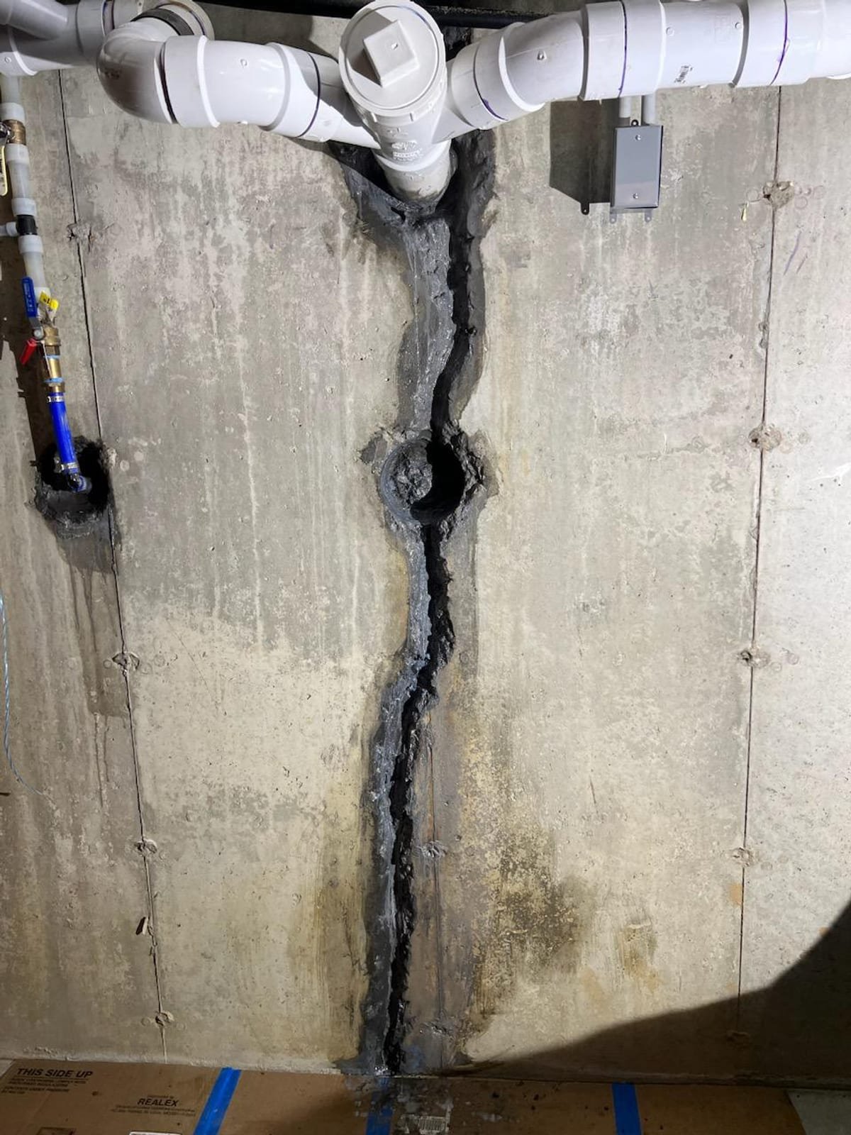 Before: foundation wall crack repair with carbon fiber grid and garage slab rebuild in Westport, CT